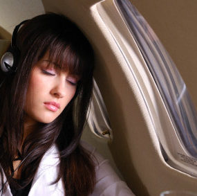 Woman sleeping on plane